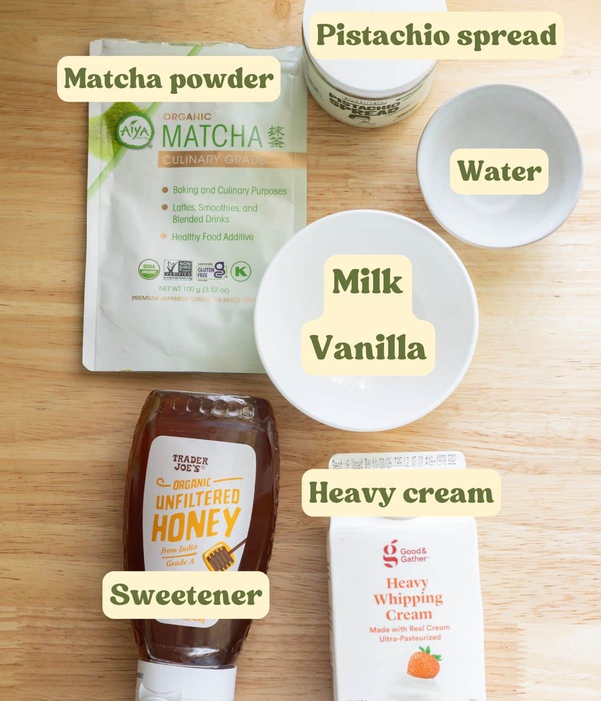 Pistachio matcha ingredients laid out on a table with labels.