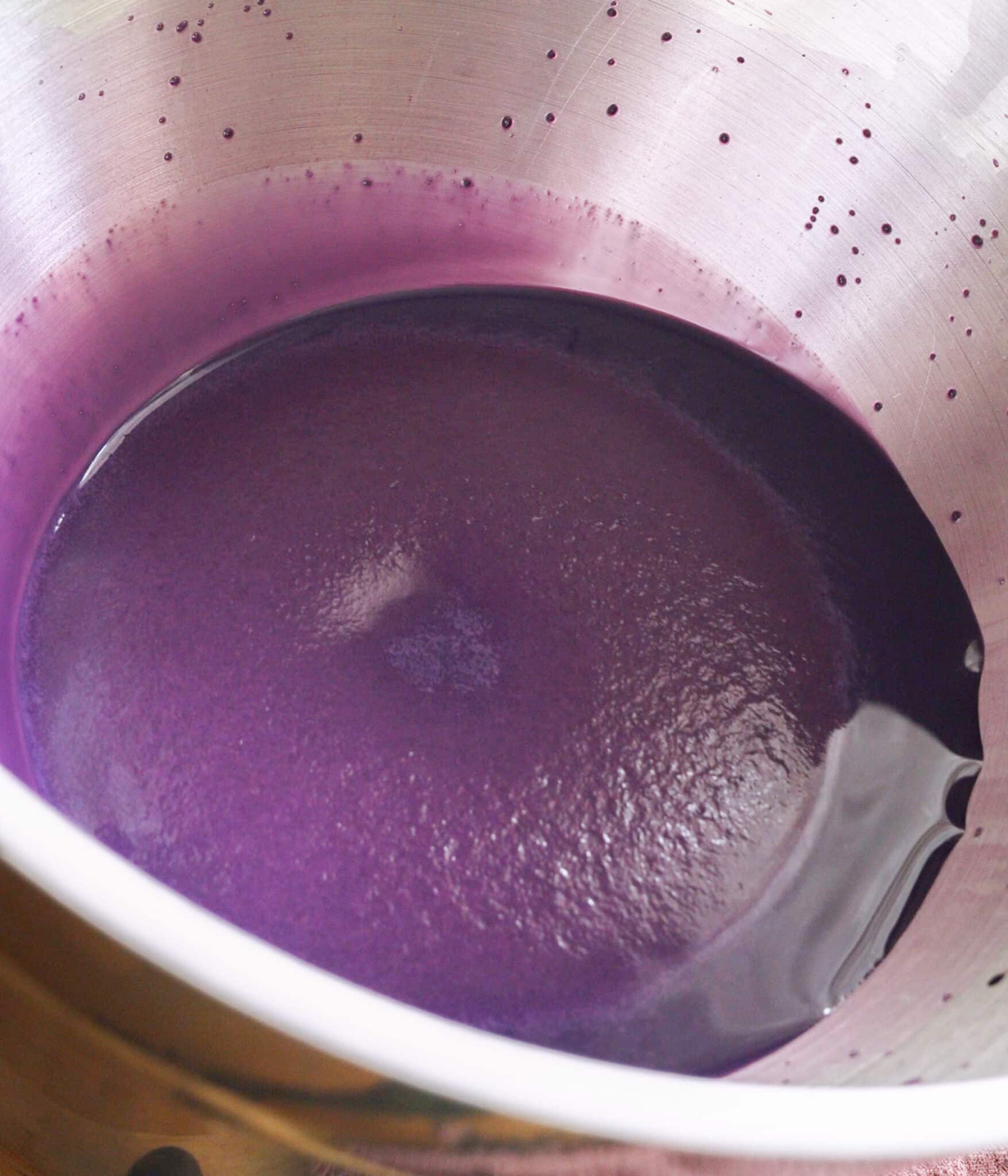 Proofed yeast in sweetened ube milk mixture.