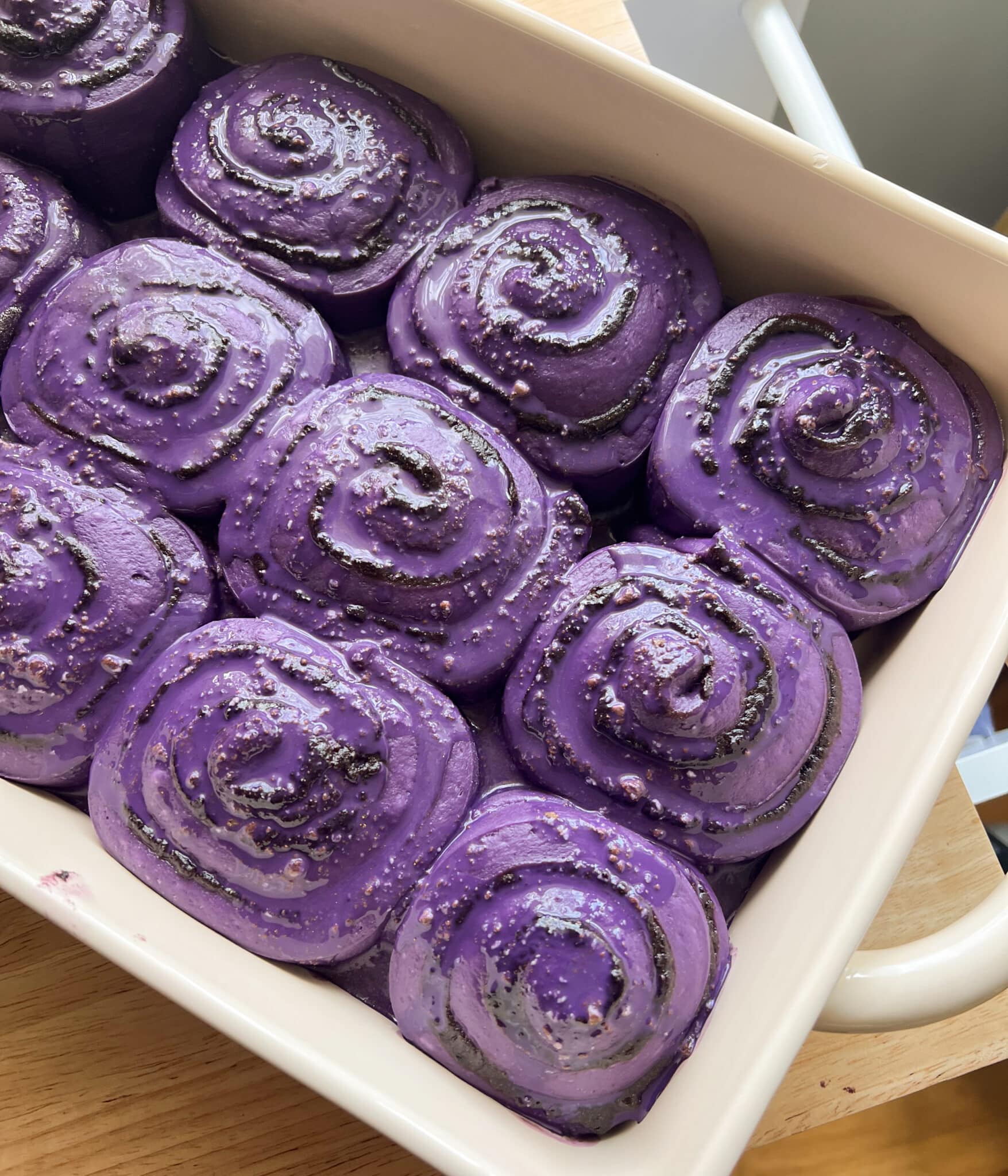 Ube cinnamon roll dough after second proof.