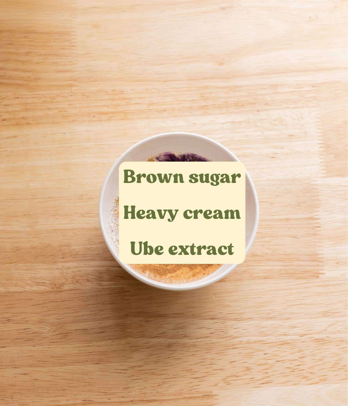Labeled ube coconut roll heavy cream ingredients laid out on a table.