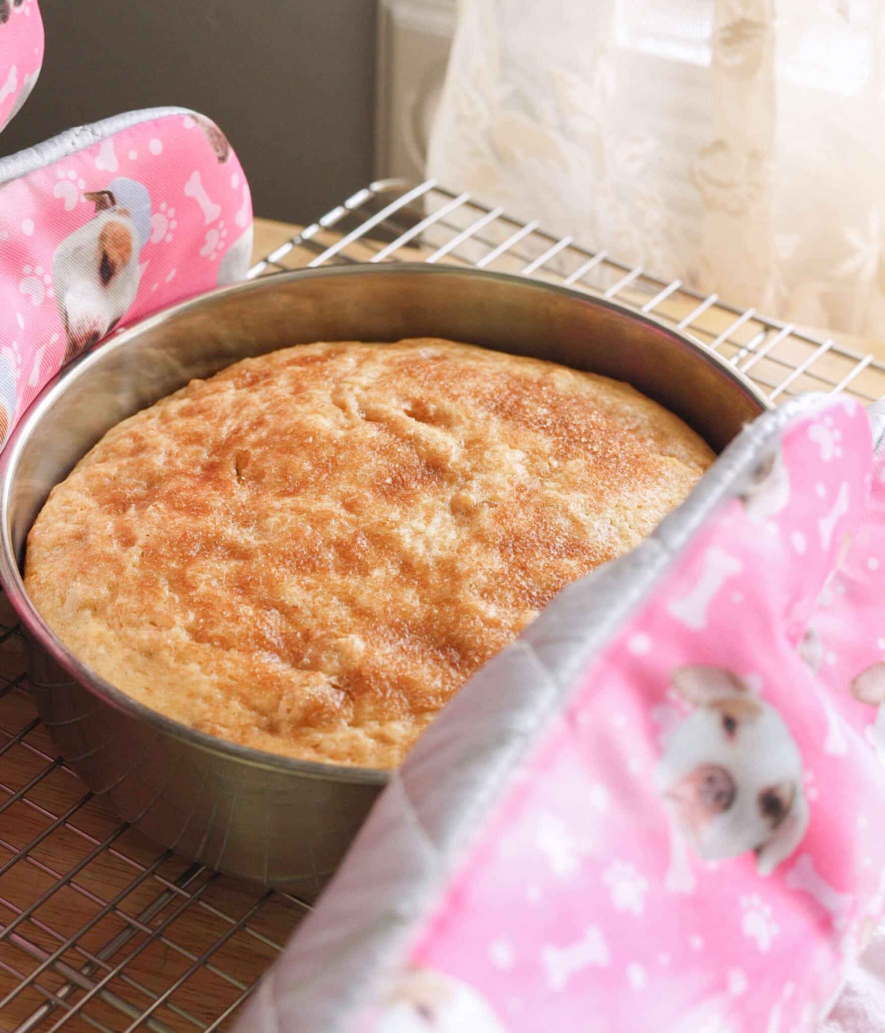 Putting baked banana cake on cooling rack.