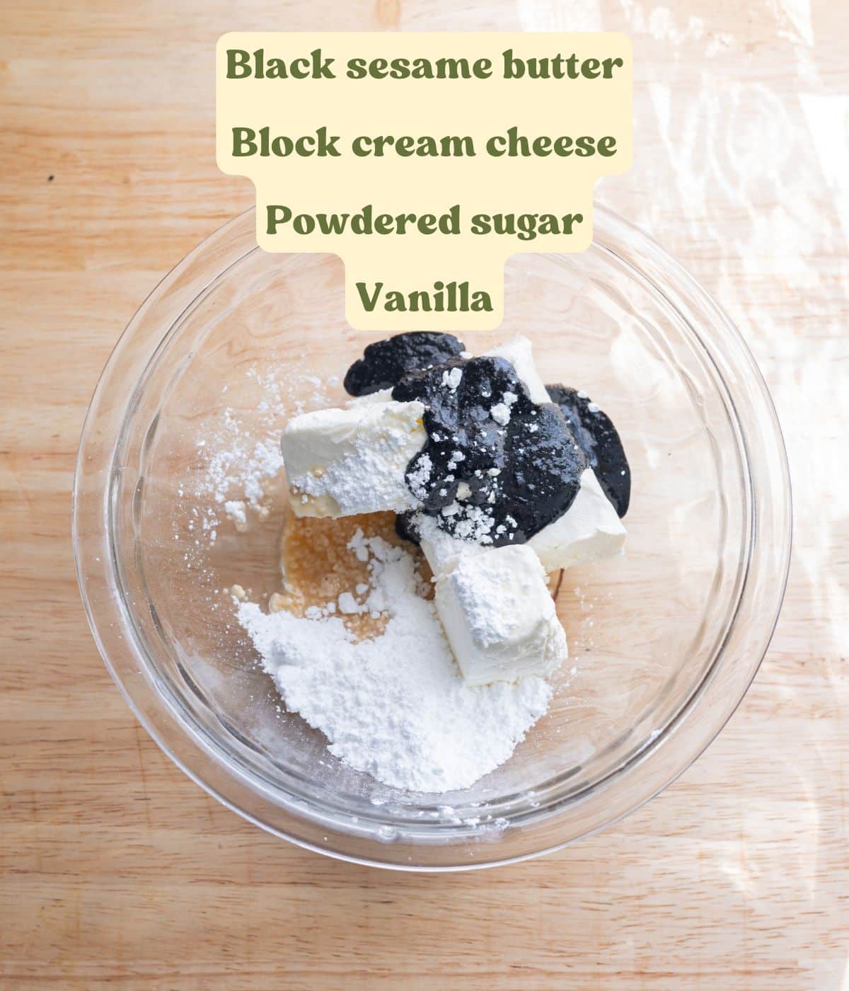 Labeled black sesame cream cheese frosting ingredients laid out on a table.