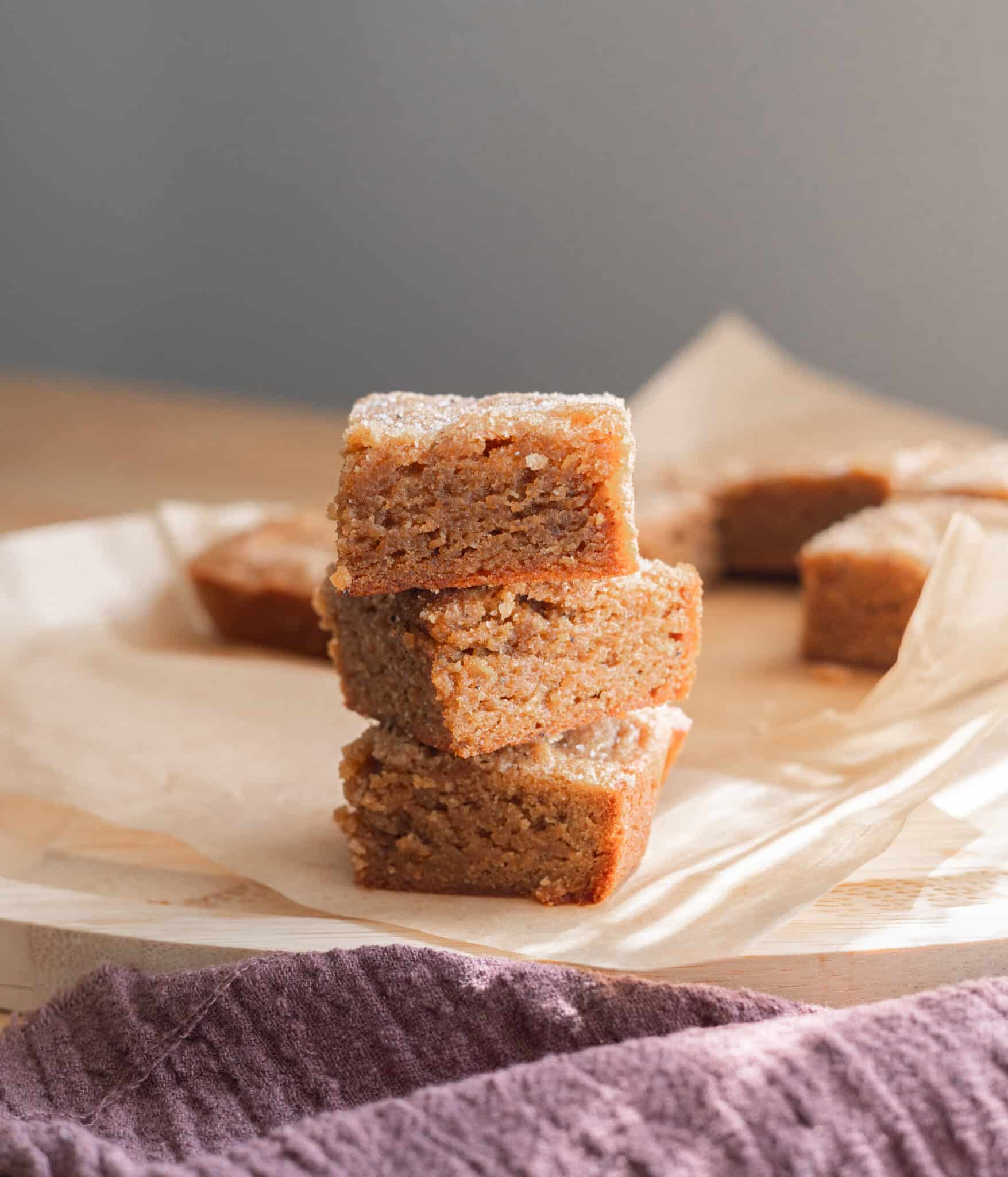 Three chai blondie bars stacked on top of one another.