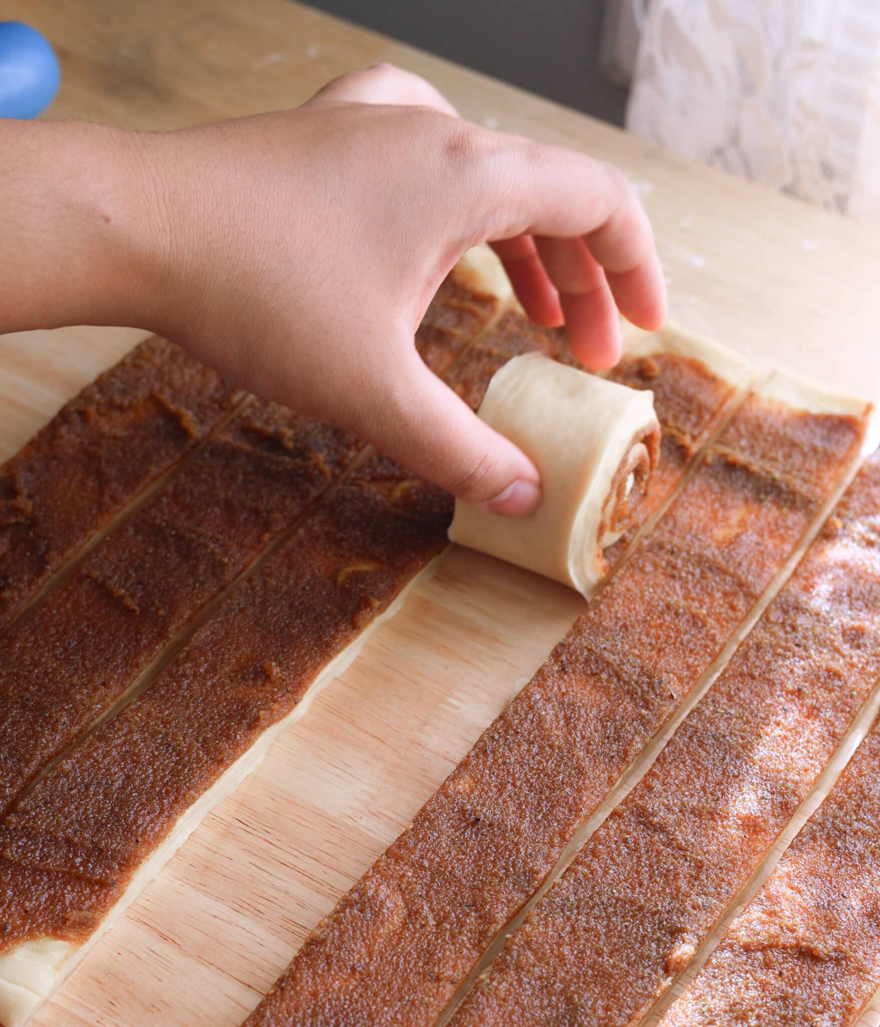 Rolling up chai cinnamon strips.