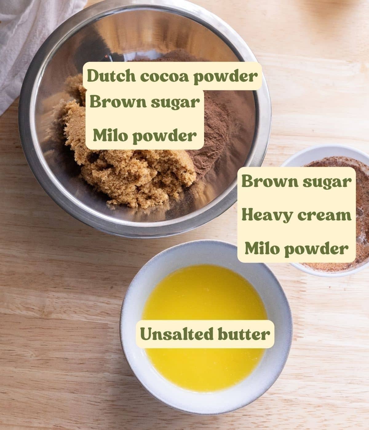 Mllo roll filling and cream ingredients labeled on a wooden table.