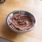 Milo frosting in a stainless steel bowl.