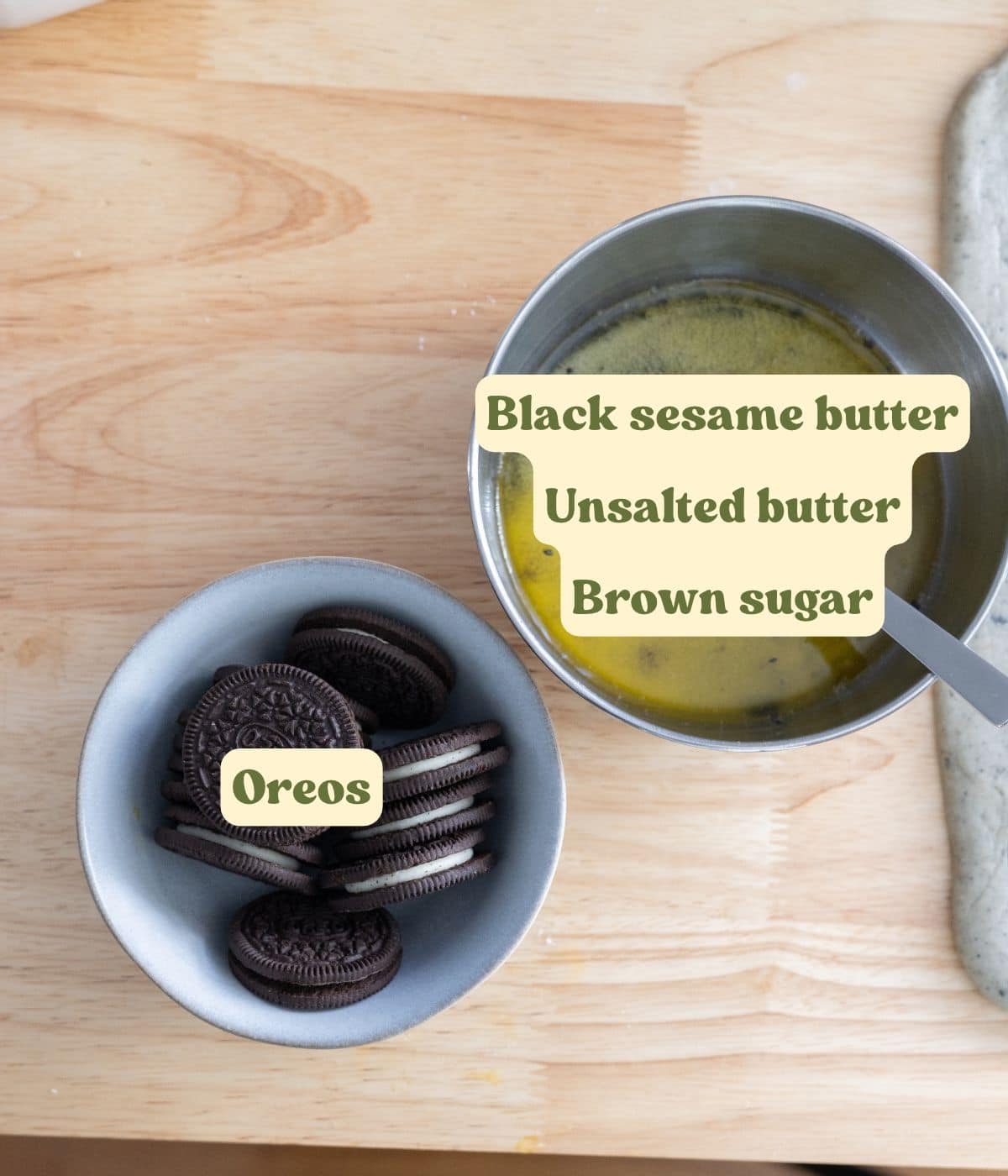 Black sesame roll filling ingredients labeled on a wooden table.