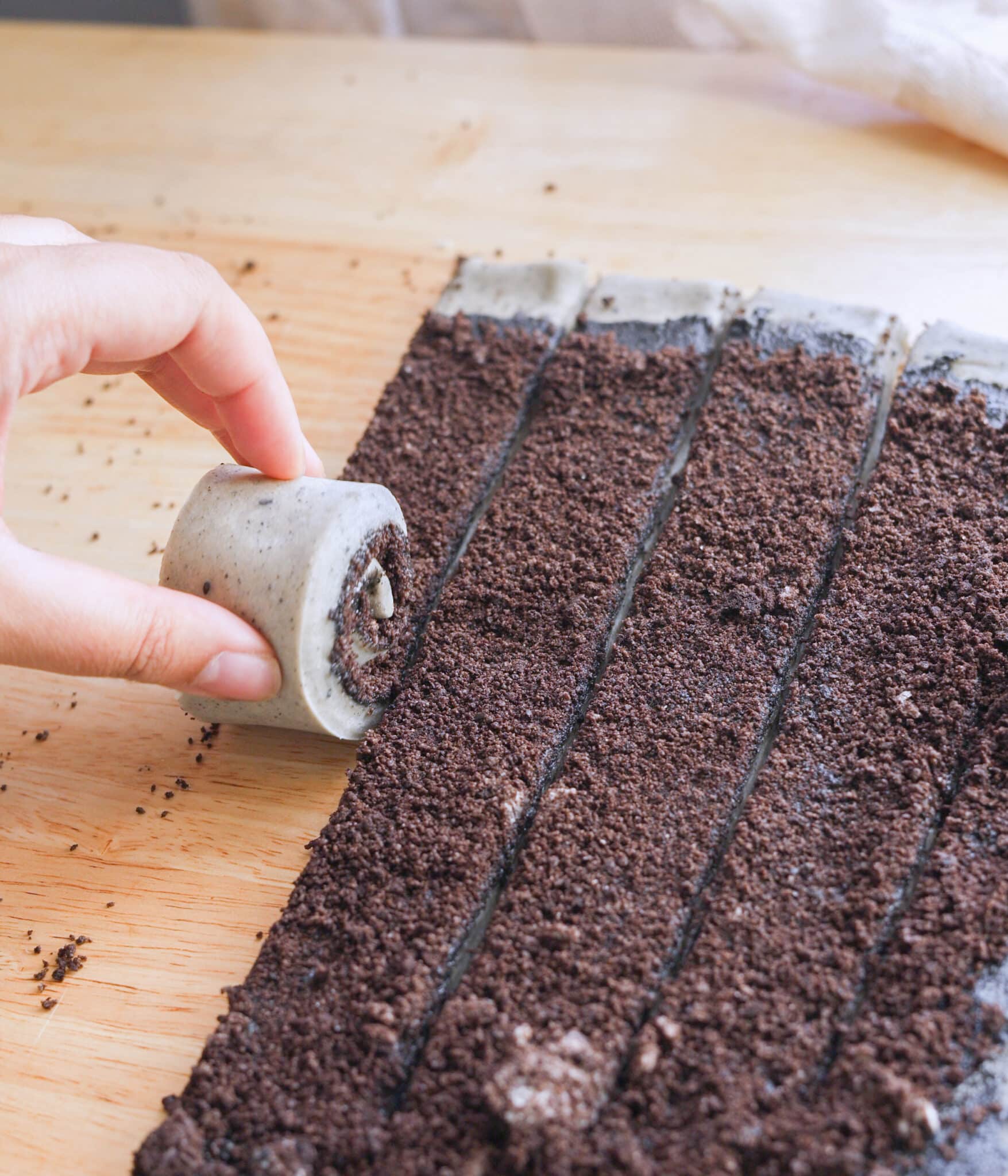 Rolling black sesame rolls up into buns.
