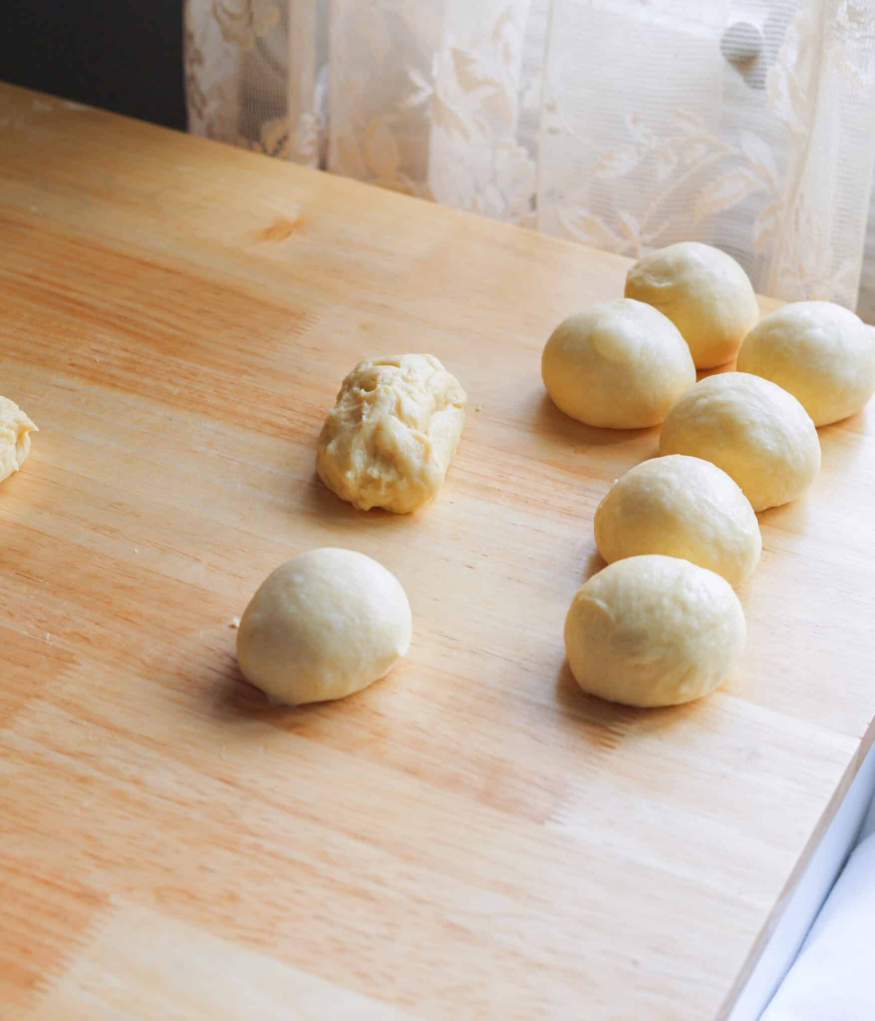 Spanish bread dough rolled into individual pre-shaped balls.
